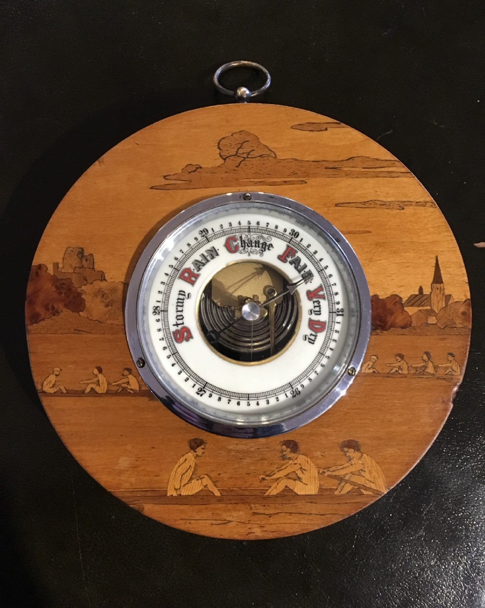 barometer depicting rowers