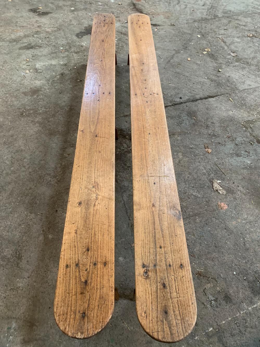 long pair of chestnut benches