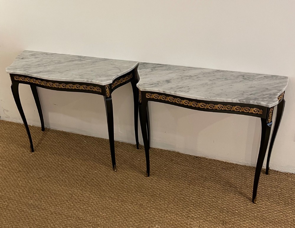 pair of marble topped console tables